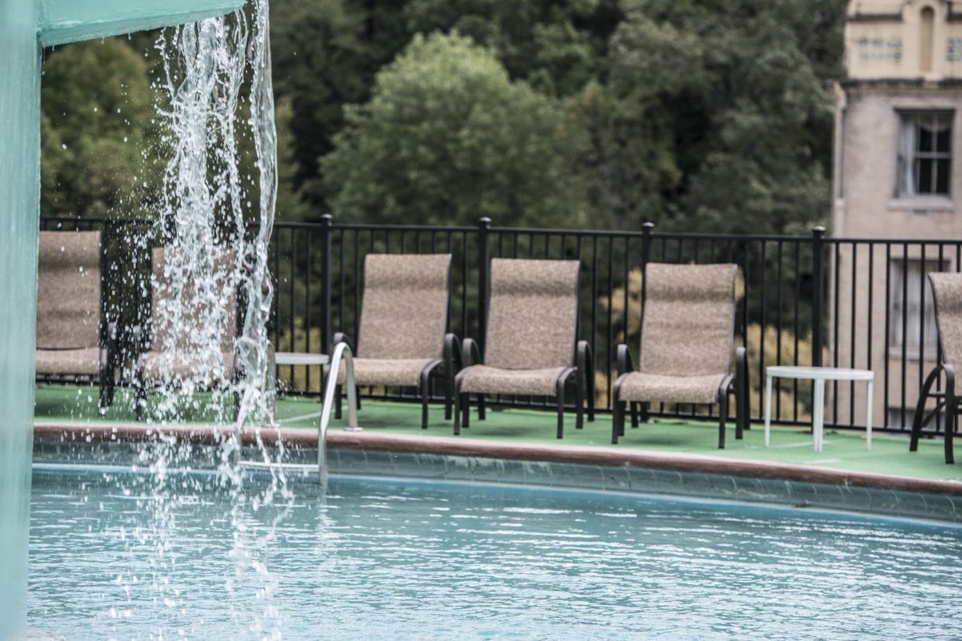 Seasonal outdoor pool, open 10:00 AM to 10:00 PM, pool loungers