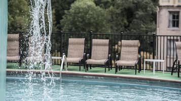 Seasonal outdoor pool, open 10:00 AM to 10:00 PM, pool loungers