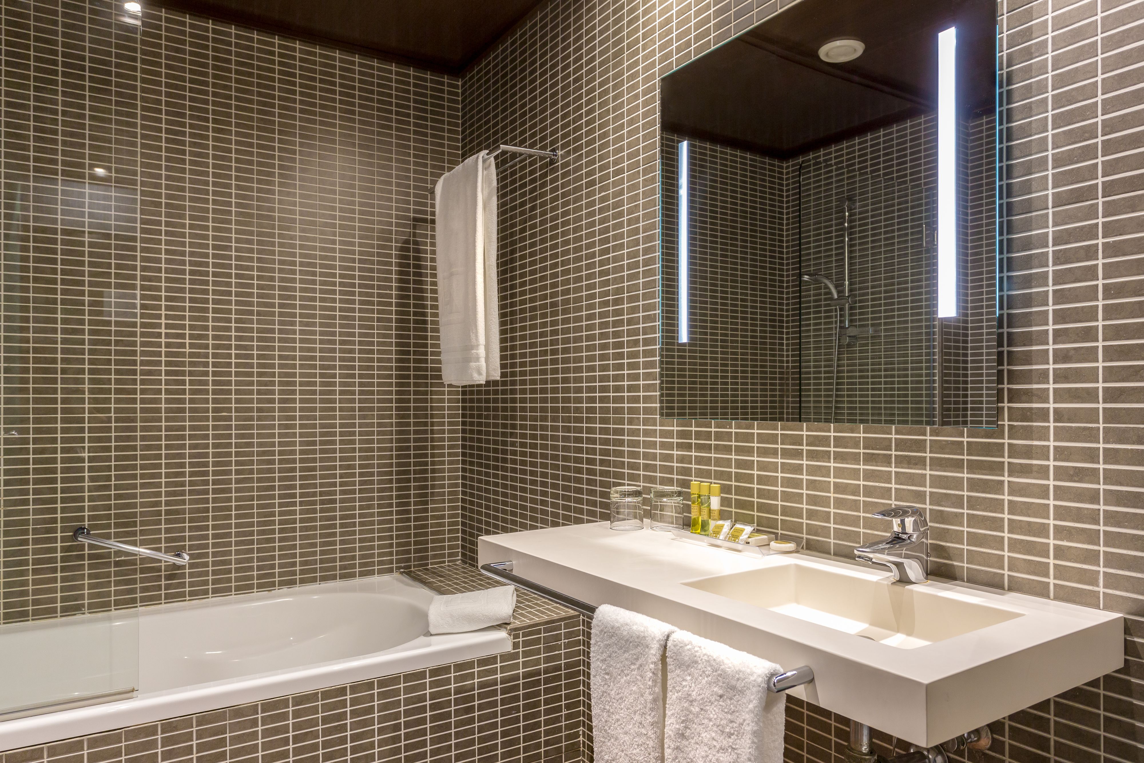 eco-friendly toiletries, hair dryer, towels