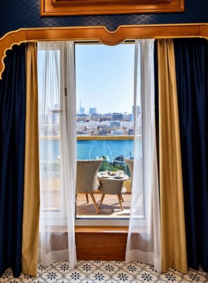 A room with a view of a city skyline through sheer curtains. - Riviera Hotel Dubai (Dubai)