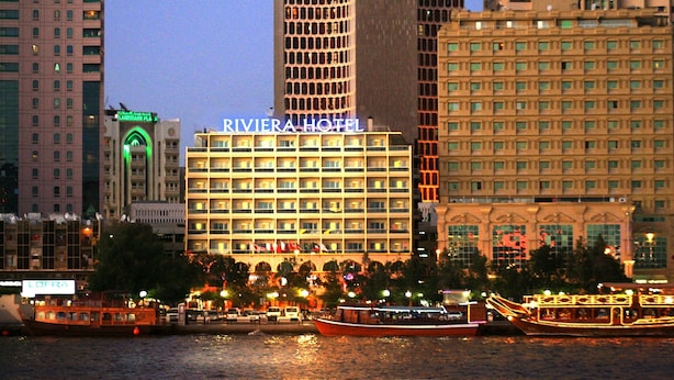 A hotel with multiple floors and a prominent sign. - Riviera Hotel Dubai (Dubai)