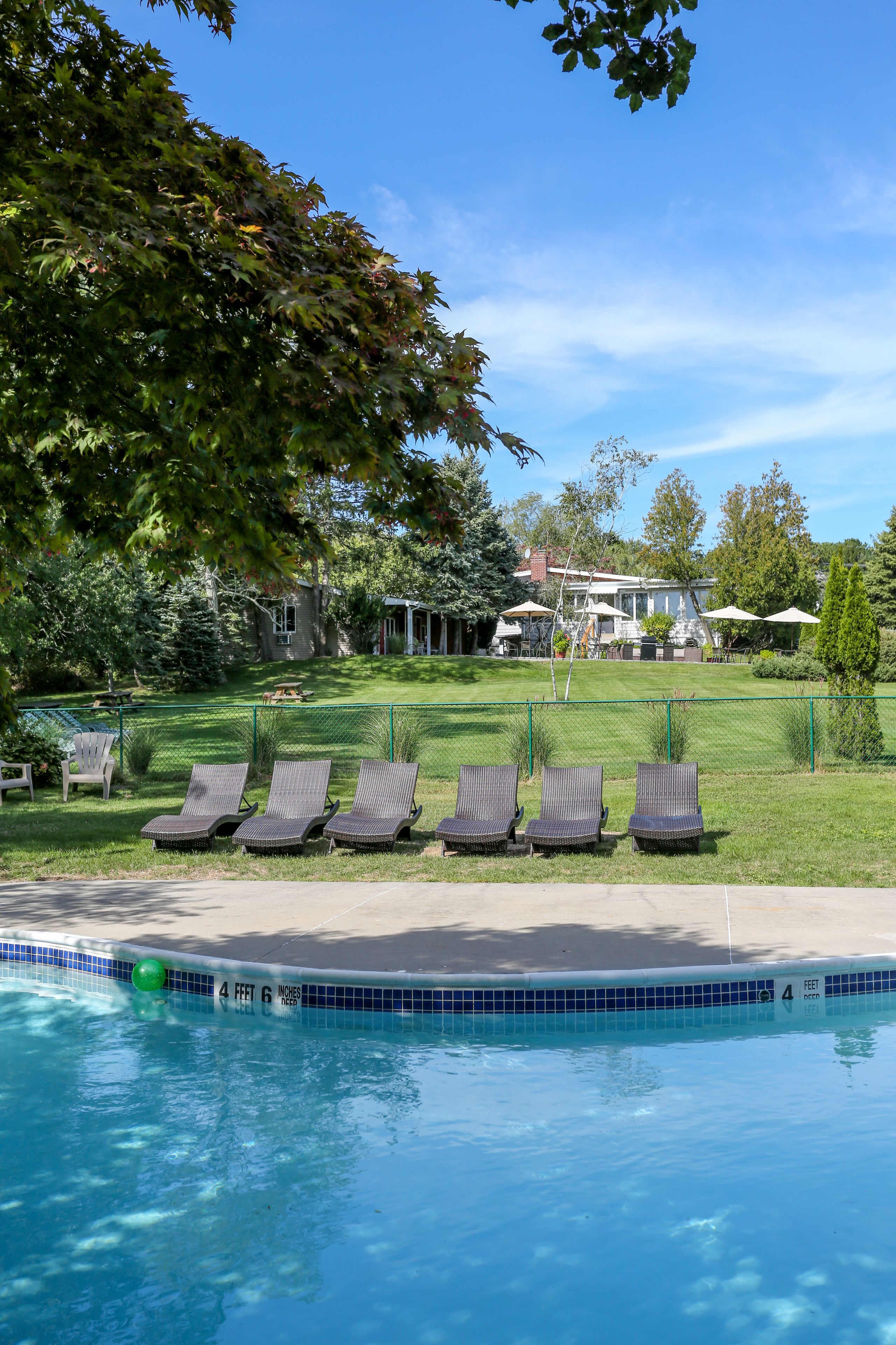 Seasonal outdoor pool, open 10:00 AM to 8:00 PM, pool umbrellas