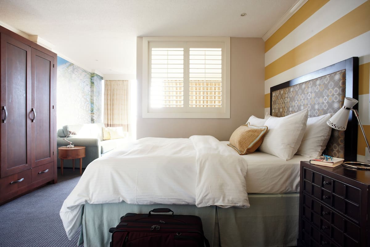 efficiency with one queen bed and pullout sofa | 1 bedroom, in-room safe, blackout curtains, iron/ironing board