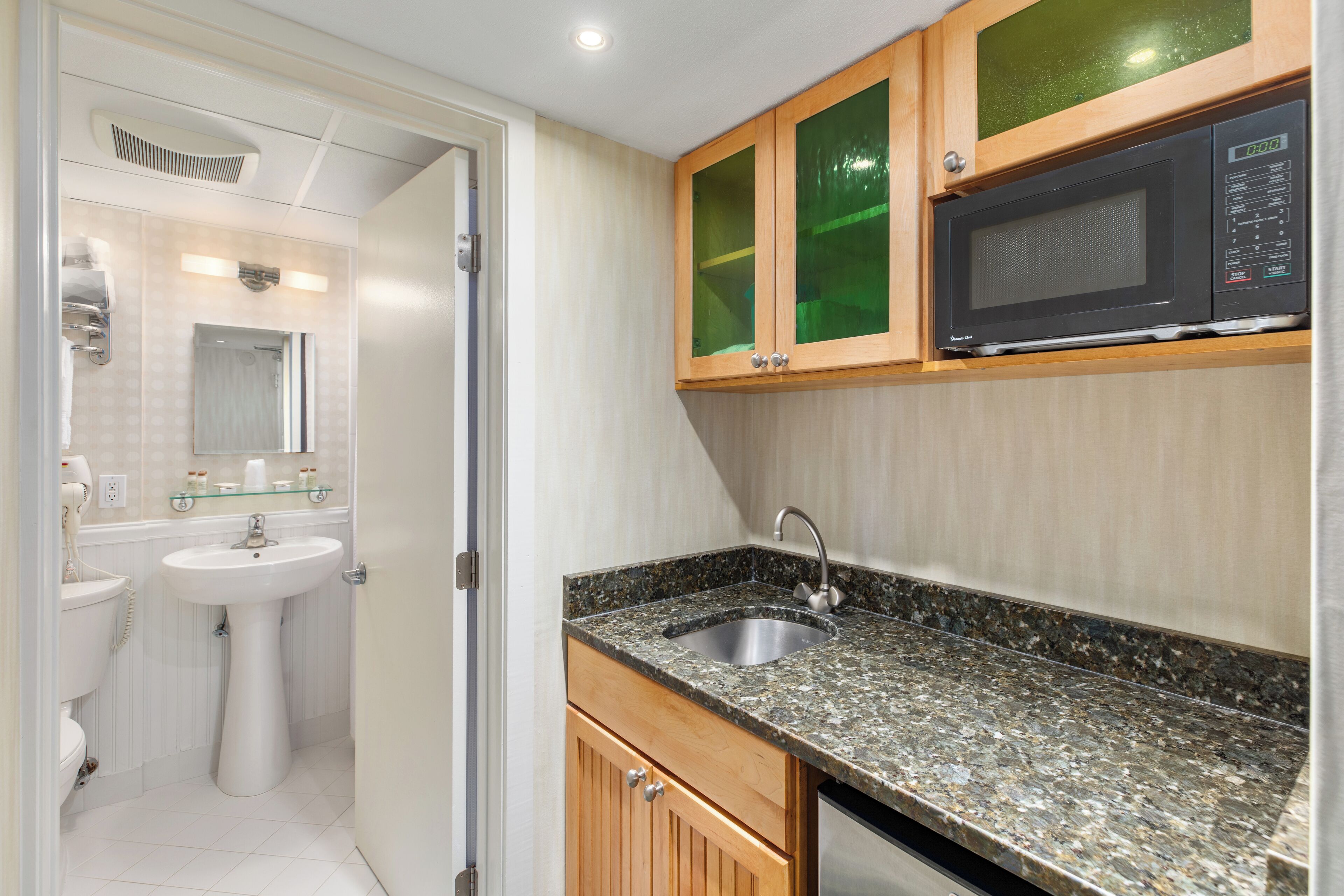 deluxe hotel room with 2 queen beds and day bed | 1 bedroom, in-room safe, blackout curtains, iron/ironing board