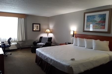 Desk, laptop workspace, blackout curtains, iron/ironing board. The Dakota