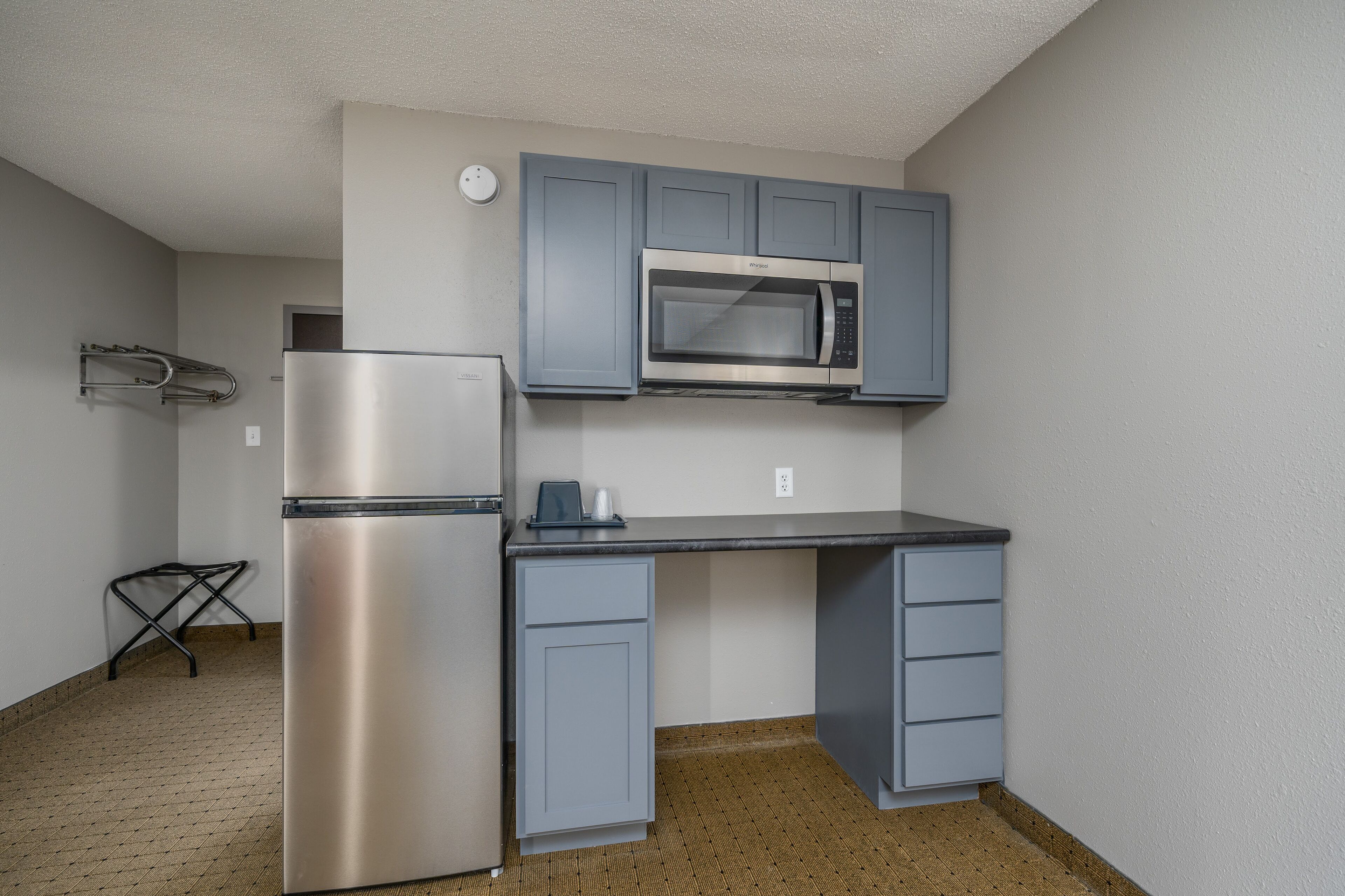 studio | desk, laptop workspace, blackout curtains, iron/ironing board