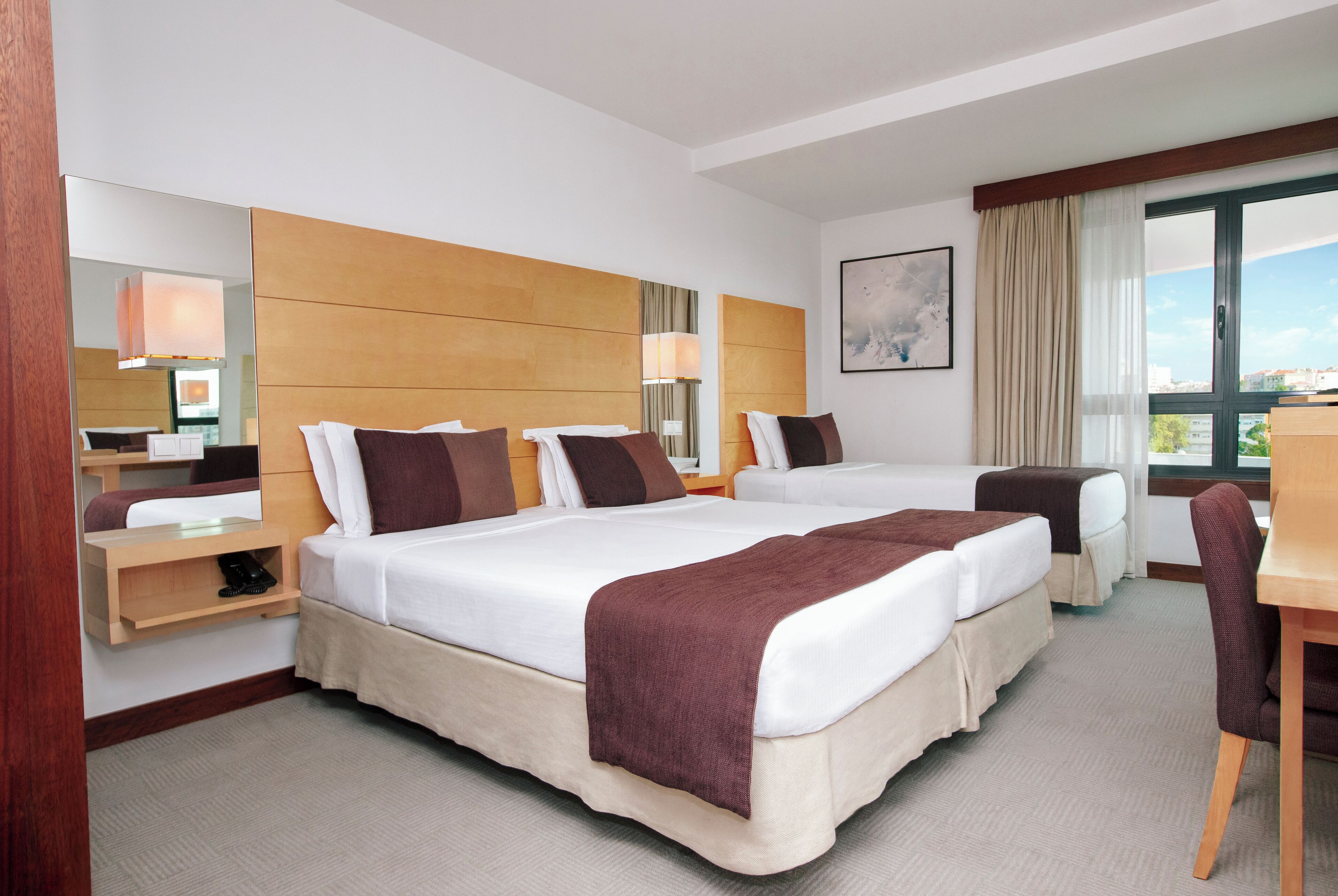 superior triple room, city view | 1 bedroom, minibar, in-room safe, desk