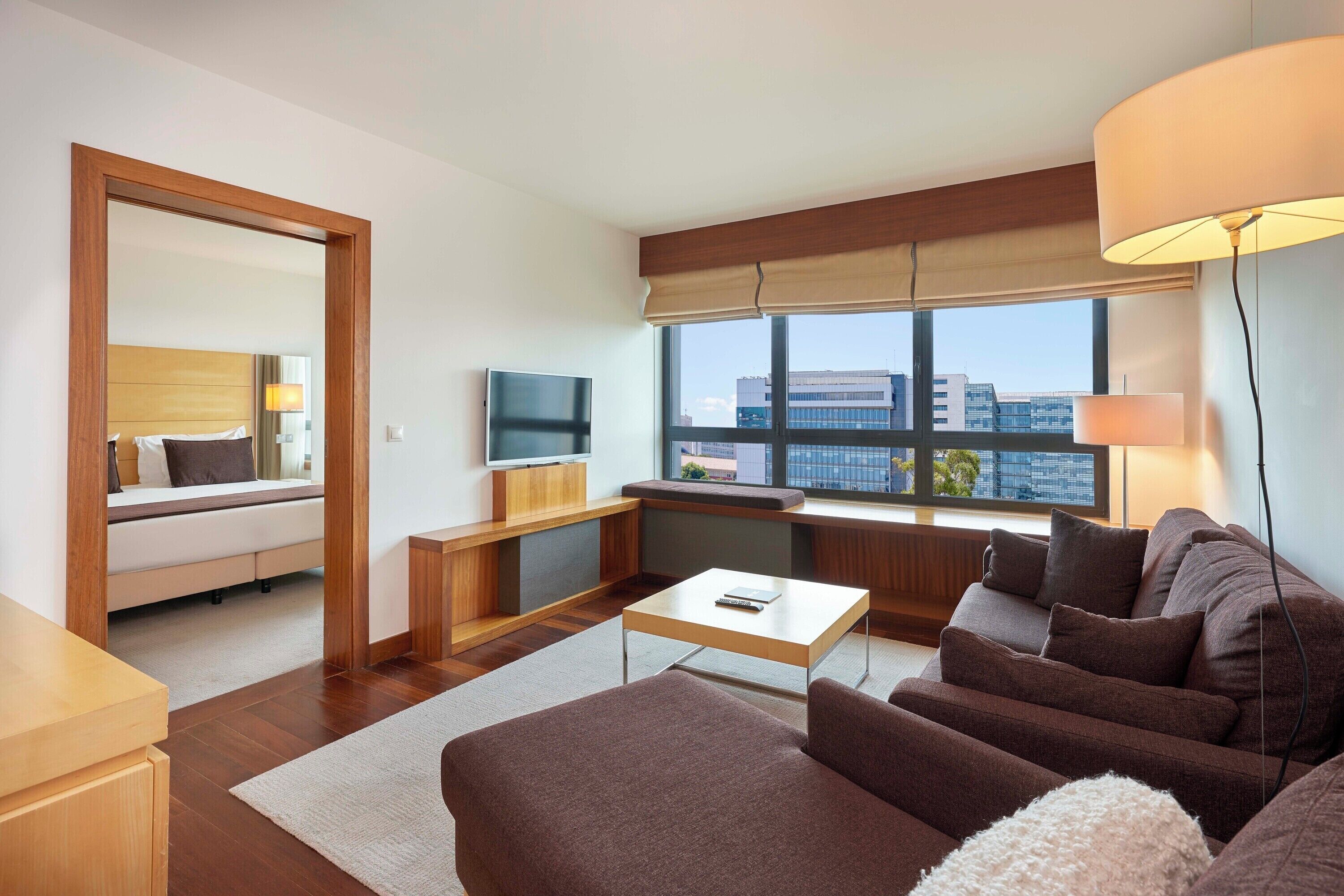 deluxe suite, city view | living area | flat-screen tv, pay films