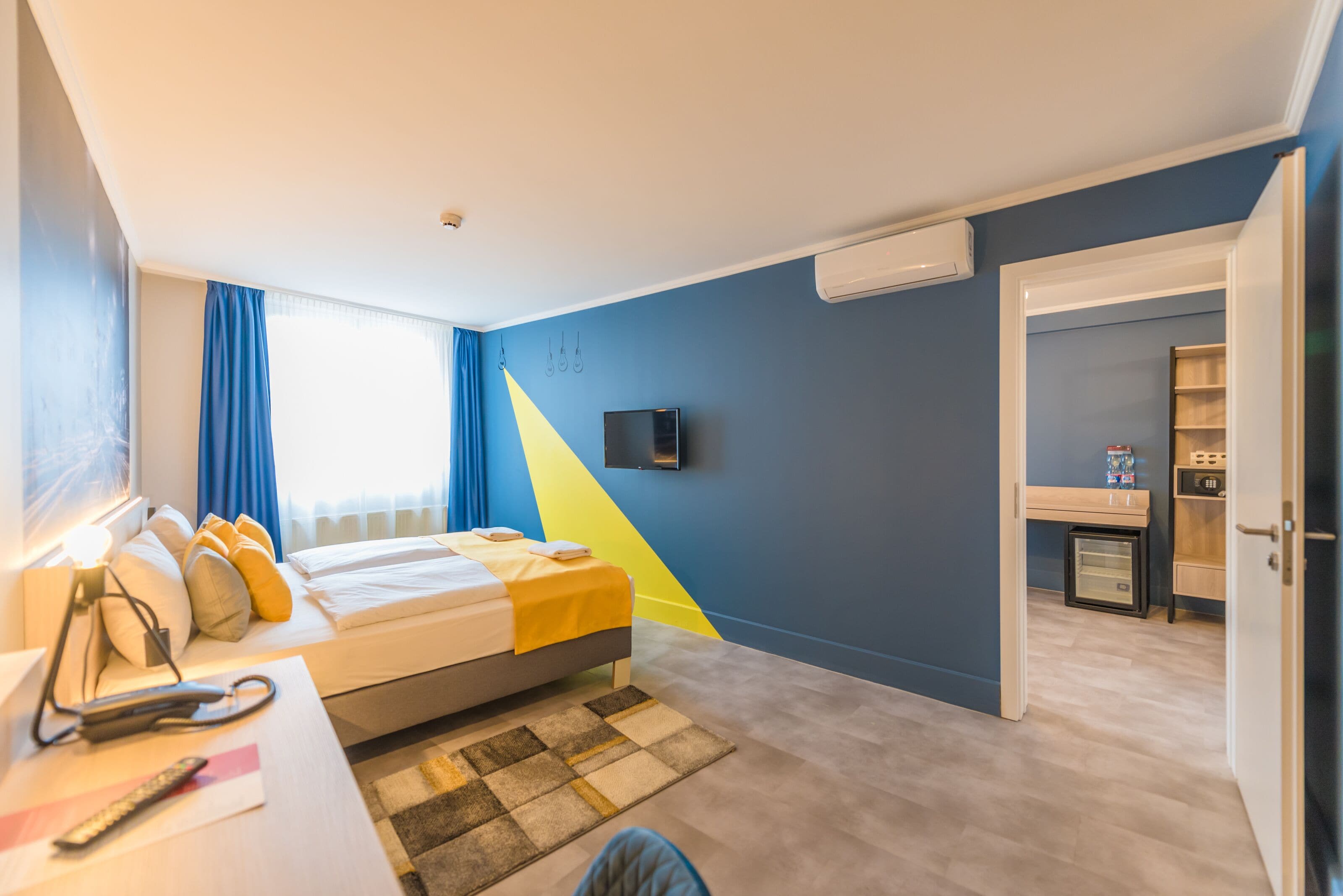 connecting family room | in-room safe, blackout curtains, iron/ironing board, free wifi