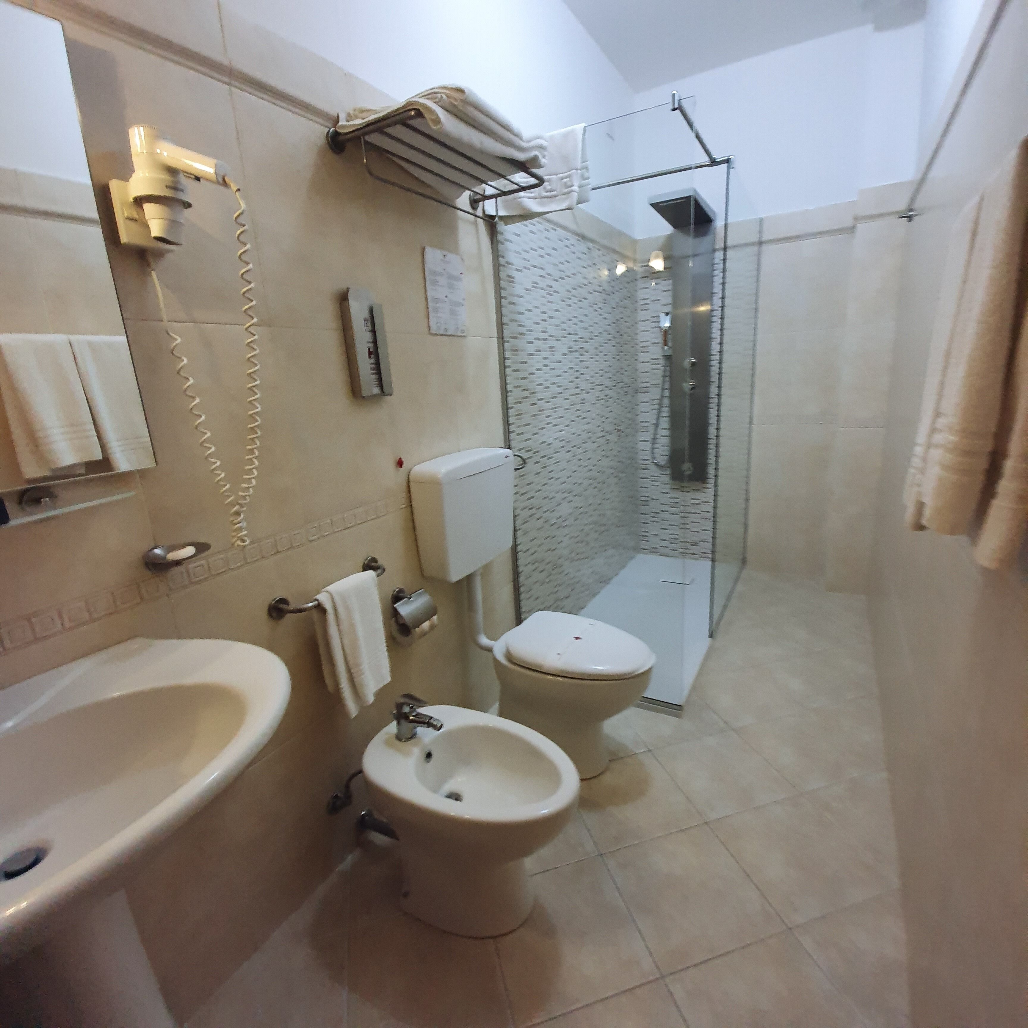 superior quadruple room | bathroom | shower, free toiletries, hair dryer, bidet