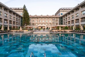 Indoor pool, seasonal outdoor pool, pool umbrellas, pool loungers