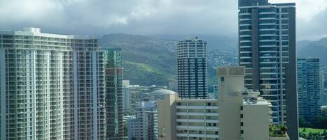 A cityscape with high-rise buildings, including a prominent hotel with multiple floors and balconies.