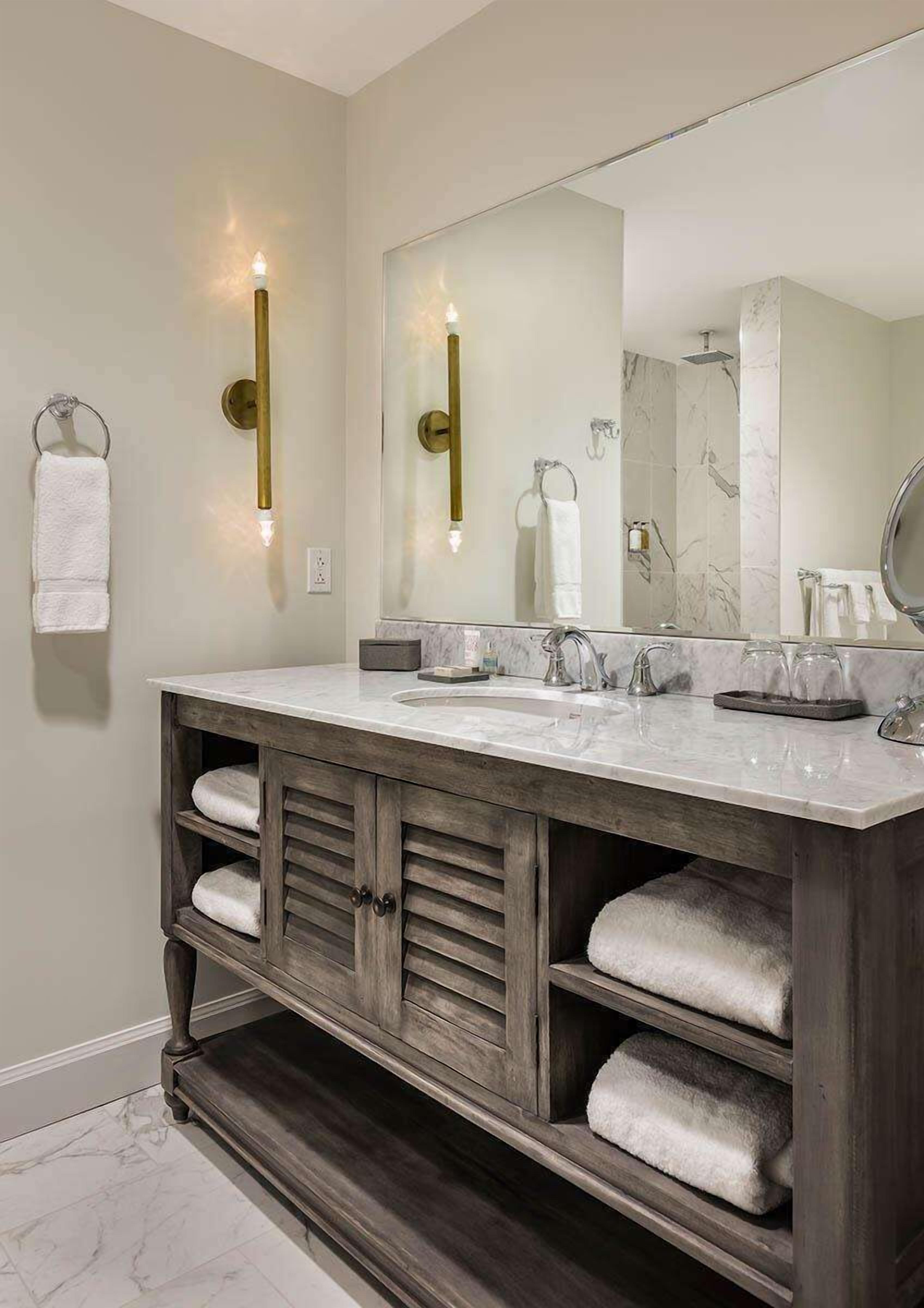 designer toiletries, hair dryer, bathrobes, towels