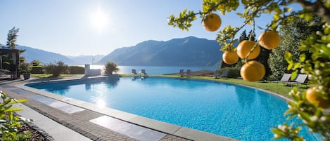 Outdoor pool, pool umbrellas, sun loungers