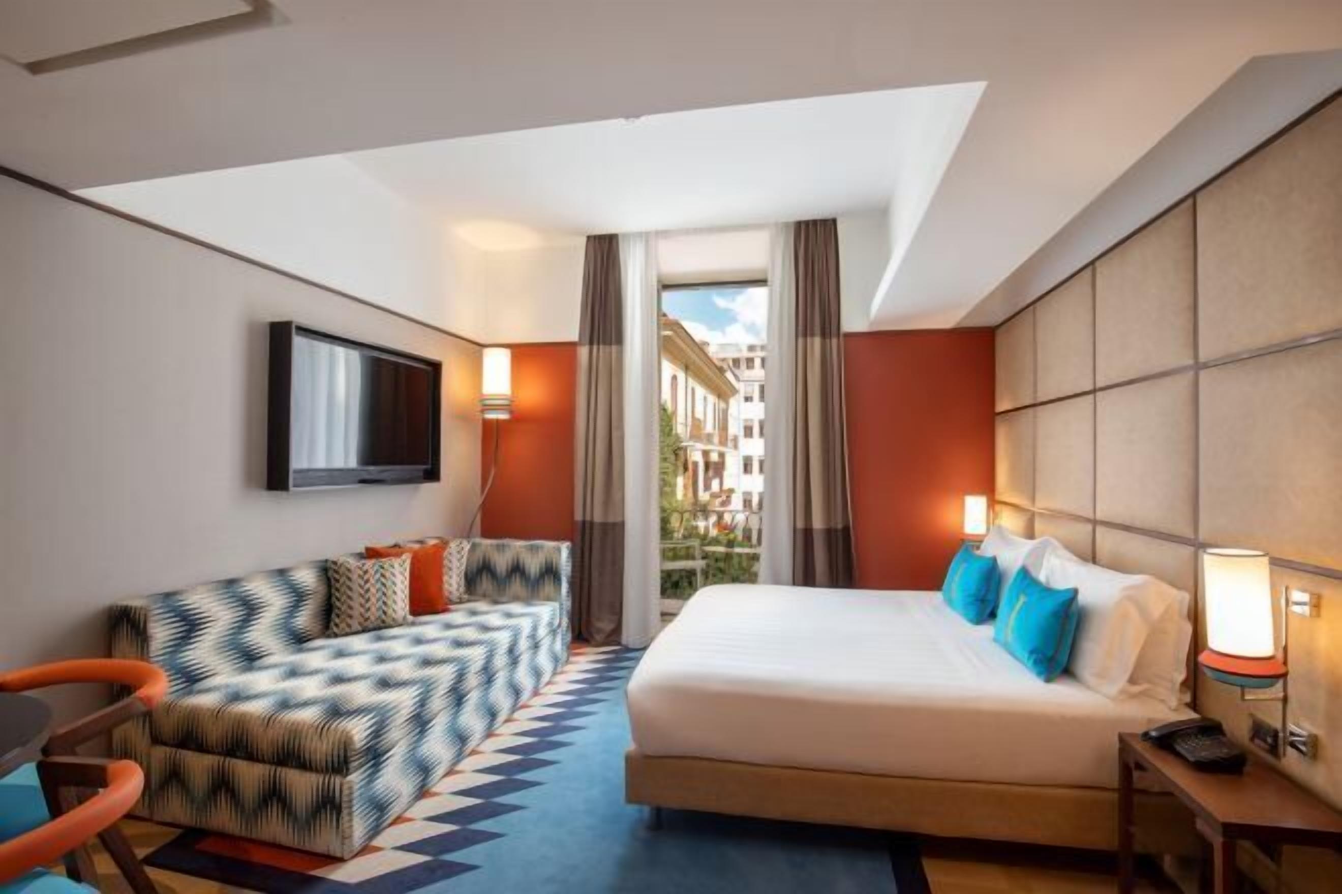 Luxe beddengoed, donzen dekbedden, een minibar, een kluis op de kamer