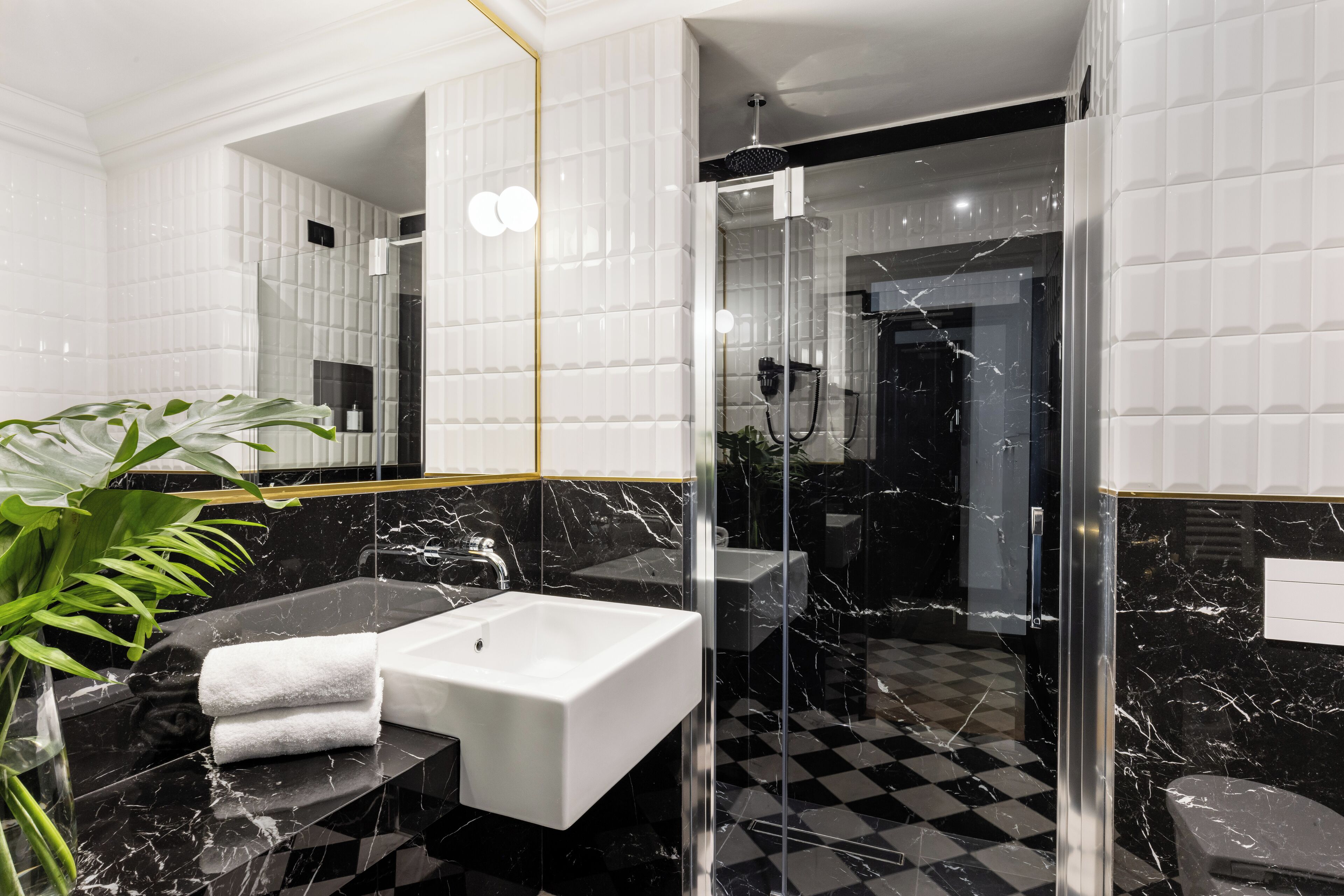 junior suite | bathroom | hair dryer, slippers, bidet, towels