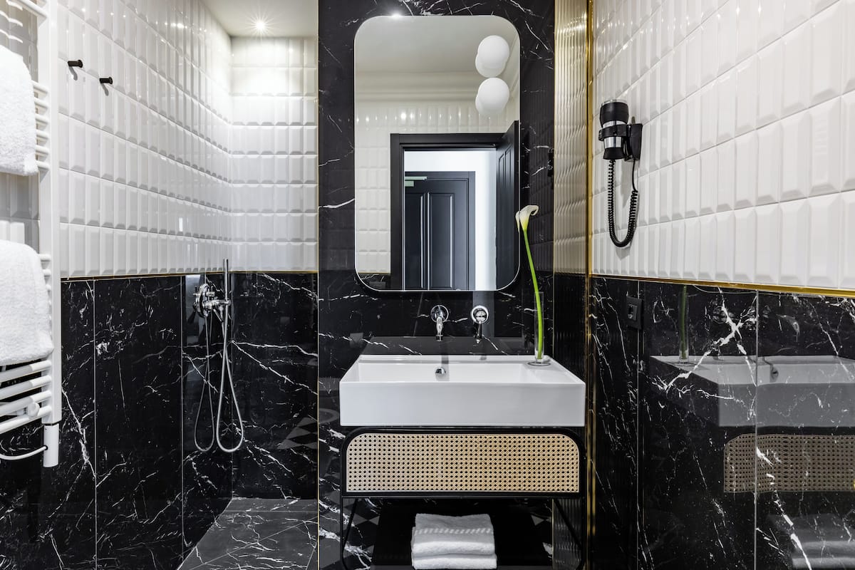 hair dryer, slippers, bidet, towels