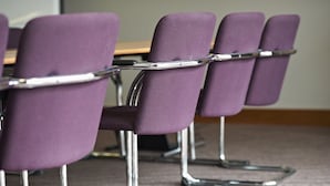 A row of purple chairs with chrome legs and a metal frame, arranged in a classroom or meeting room setting. - Leonardo Hotel Nottingham  (Nottingham)