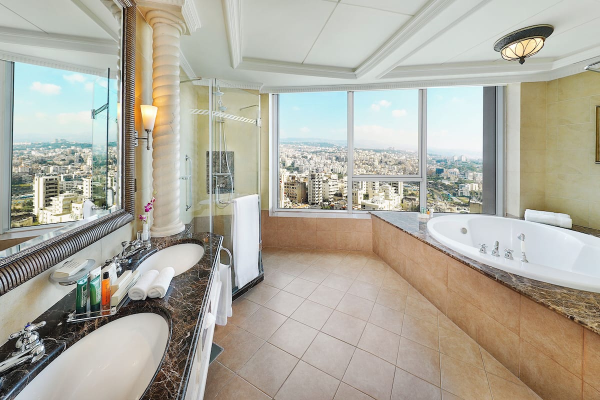 ambassador suite | bathroom | separate bathtub and shower, rainfall showerhead, free toiletries