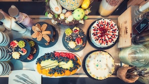 A variety of food items and dishes on a table, including cakes, pastries, and fruit arrangements. - BRISTOL Hotel Opatija (Opatija)