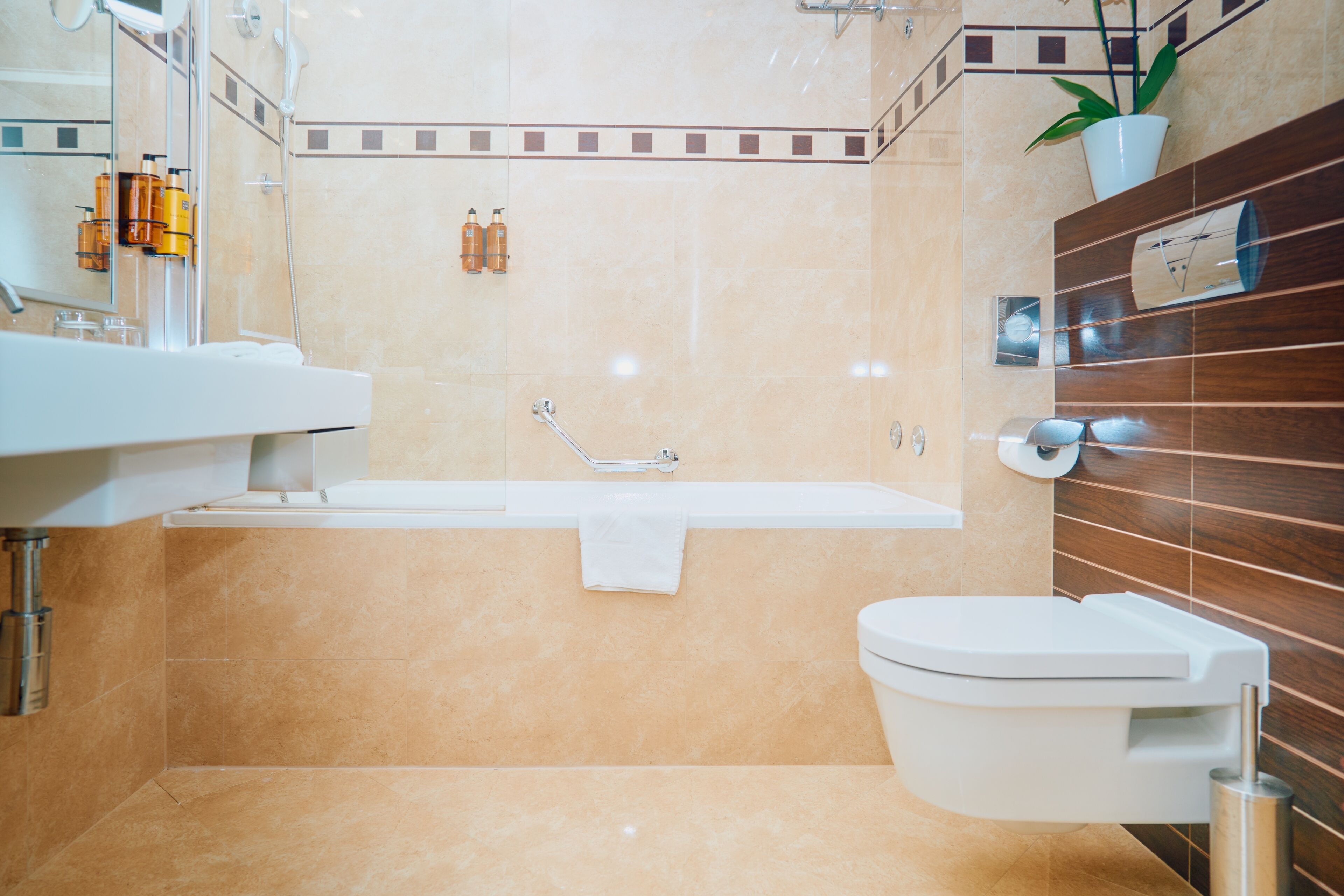 bathtub, free toiletries, hair dryer, towels