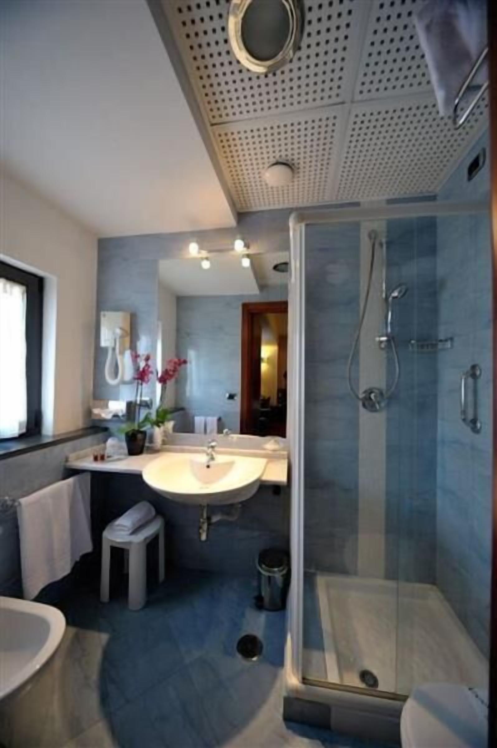 triple room | bathroom | deep-soaking bathtub, rainfall showerhead, designer toiletries