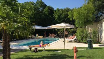 Outdoor pool, pool umbrellas, sun loungers