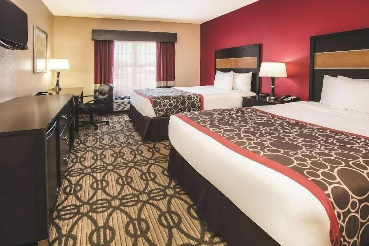 Premium bedding, pillow-top beds, desk, blackout curtains