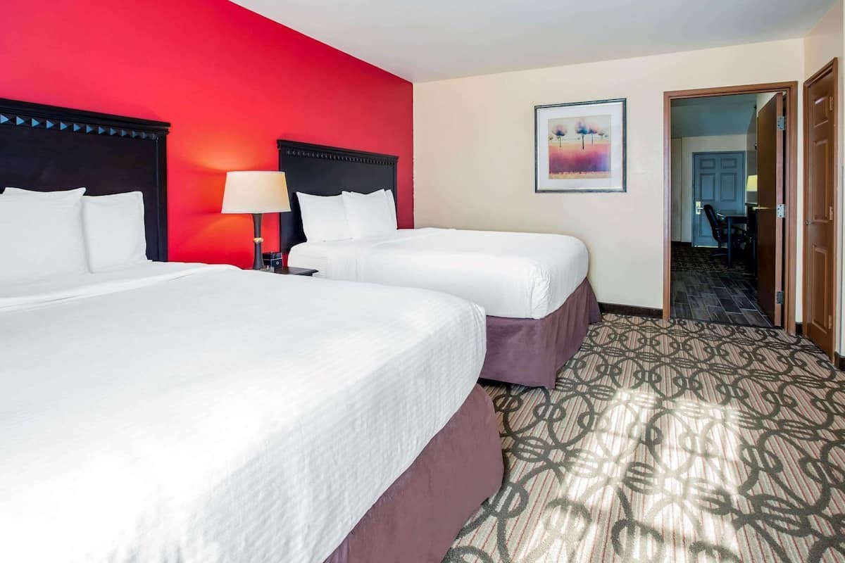 Premium bedding, pillow-top beds, desk, blackout curtains