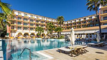 Indoor pool, outdoor pool, open 8 AM to 8 PM, pool umbrellas
