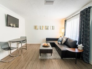 42-inch flat-screen TV with satellite channels, TV - Hibiscus Suites - Gateway to Siesta Key (Sarasota)