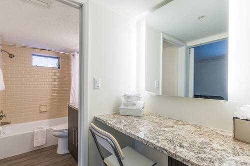 Designer toiletries, hair dryer, towels