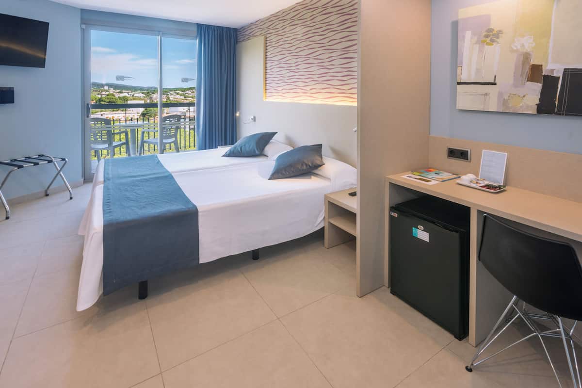 Standard Double Room, Partial Sea View | Minibar, desk, blackout drapes, soundproofing