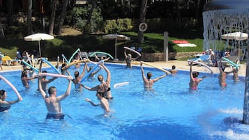 Relax by the pool with lounge chairs and umbrellas, and enjoy the soothing water feature.