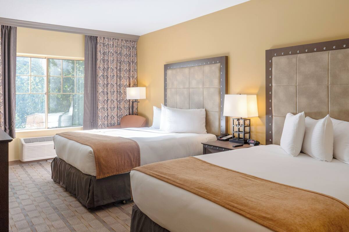 deluxe room, 2 queen beds | premium bedding, desk, blackout curtains, iron/ironing board