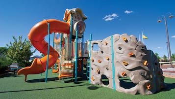 Kids can climb and slide in this play area with a rock wall and slide.