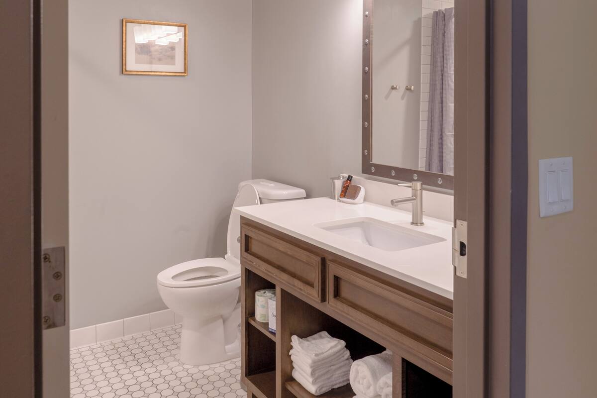 deluxe room, 2 queen beds | bathroom | combined shower/bathtub, free toiletries, hair dryer, towels