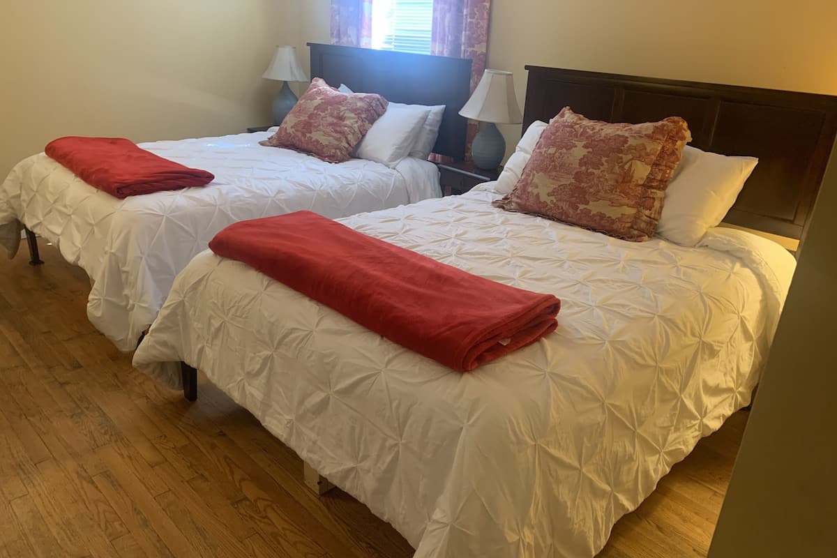 Deluxe Quadruple Room, 2 Queen Beds, Garden View | Iron/ironing board, free WiFi, bed sheets