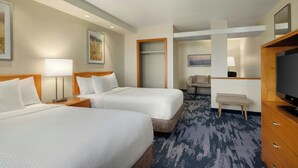 A hotel room with two beds, a desk, a chair, a TV, and a door leading to a bathroom. - Fairfield Inn & Suites by Marriott Springdale (Springdale)