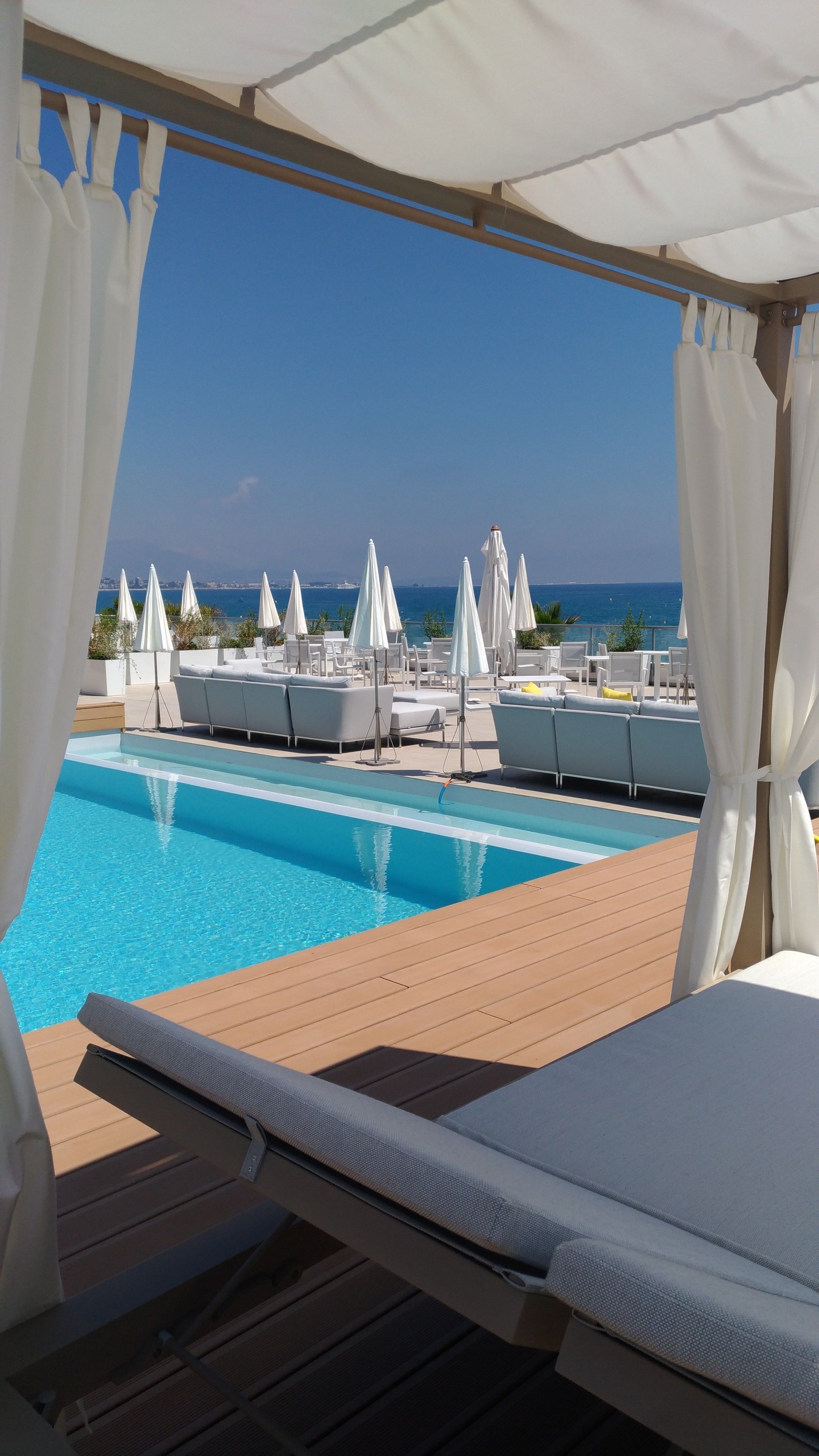 seasonal outdoor pool, pool umbrellas, pool loungers