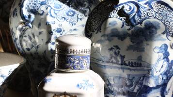A collection of ornate ceramic containers with intricate blue designs and gold accents.