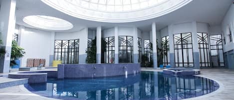 Indoor pool, outdoor pool, pool umbrellas, sun loungers