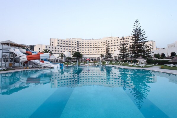 Indoor pool, outdoor pool, pool umbrellas, pool loungers