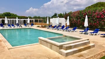 Outdoor pool, pool umbrellas, sun loungers