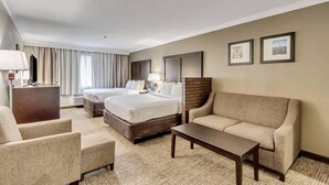 A hotel room with two beds, a sofa, a desk, and a TV. - Comfort Inn Murray - Salt Lake City South (Murray)