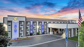 Welcome to the Comfort Inn, a two-story building with a flat roof and symmetrical facade.