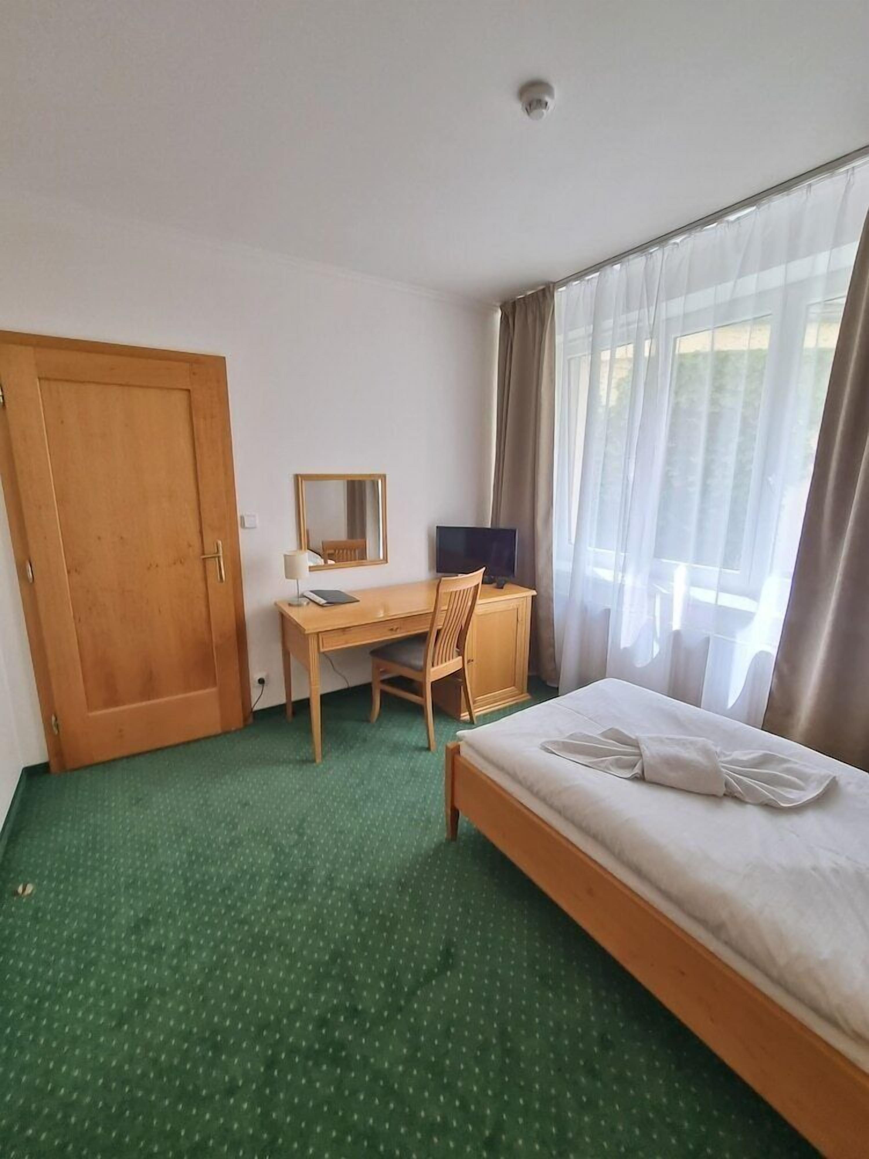 Desk, blackout curtains, free WiFi, bed sheets