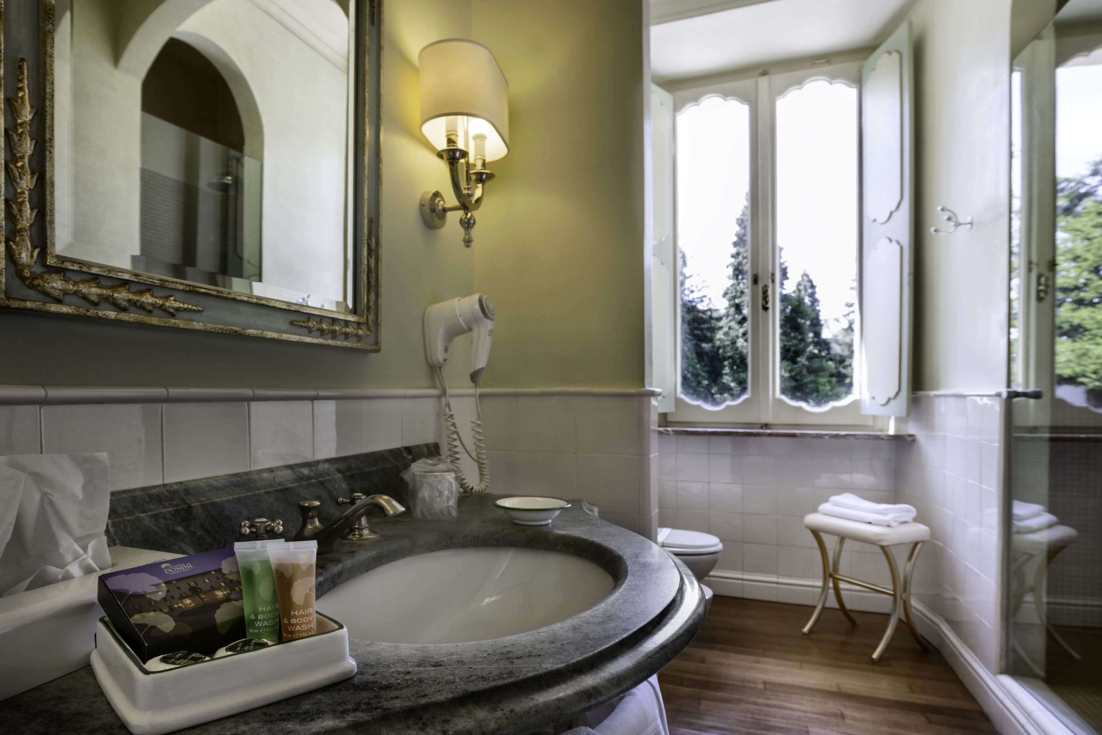 junior suite | bathroom | combined shower/bathtub, free toiletries, hair dryer, bathrobes