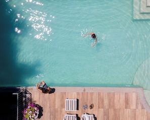 Seasonal outdoor pool, pool umbrellas, pool loungers