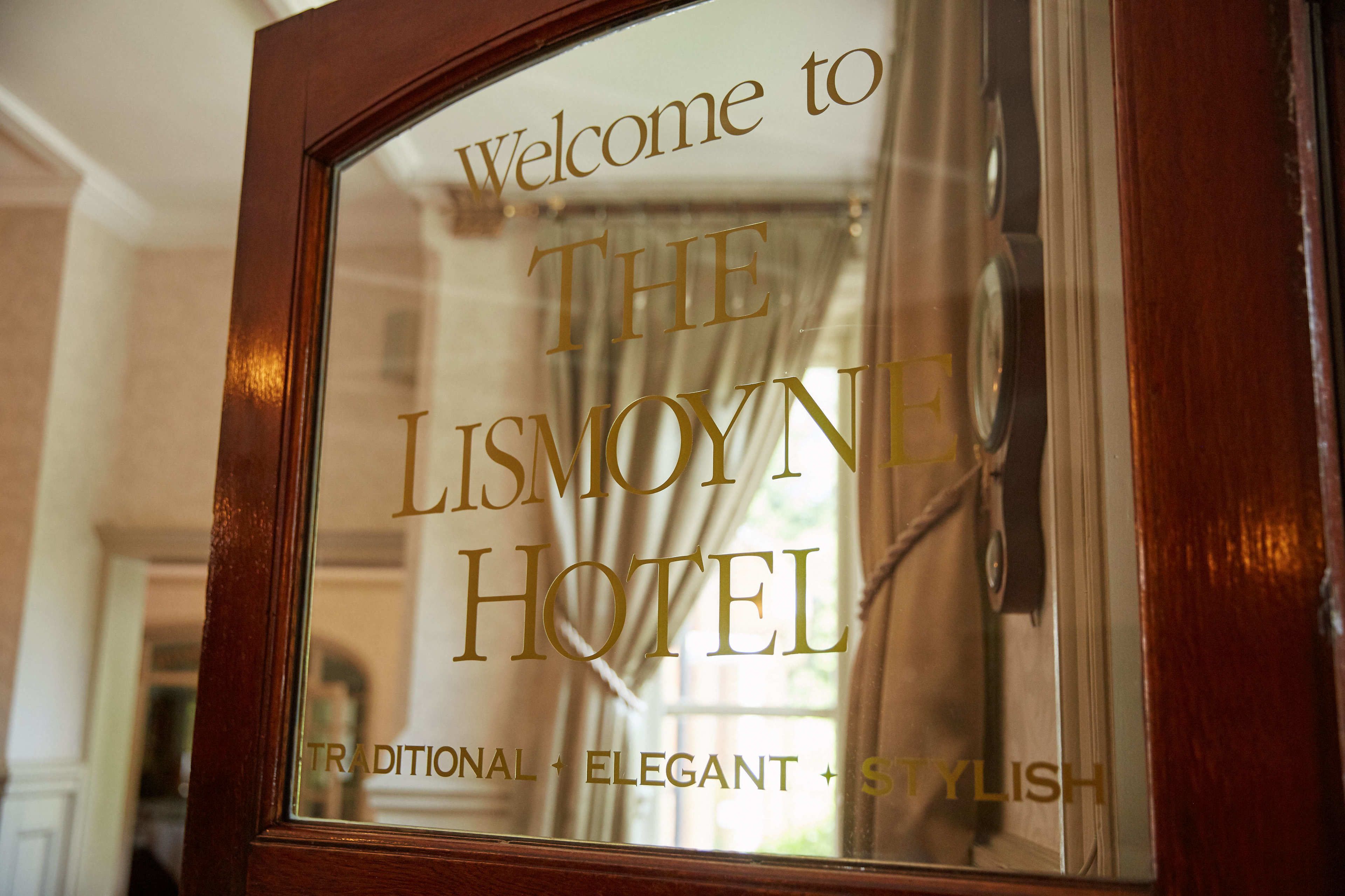 A framed welcome sign for The Lismoyne Hotel, stating "Welcome to The Lismoyne Hotel" with descriptors "Traditional, Elegant, Stylish" below.